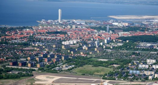 Above aerial photo of Malmö. Picture from the City of Malmö. The white tower is the Turning Tower. On map below: Green areas are owned by the Municipality.White indicates predominately private (or state) ownership. Provided by Malmö Fastighetskontor.